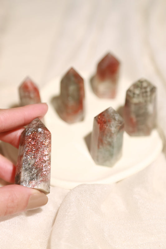 Arusha Sunstone with Green Beryl Point