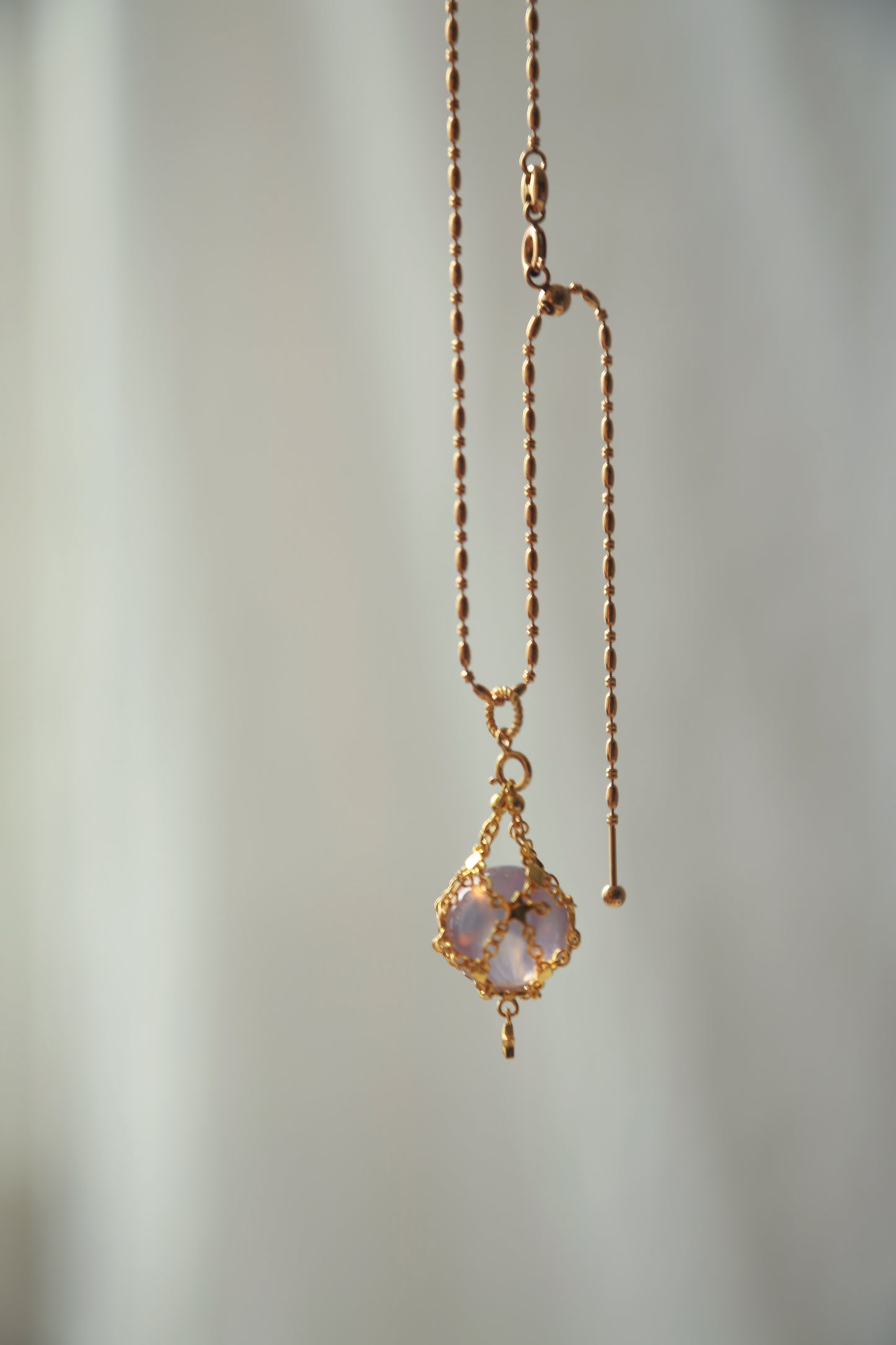 Lavender Moon Quartz Sphere in Star Catcher Mesh Necklace